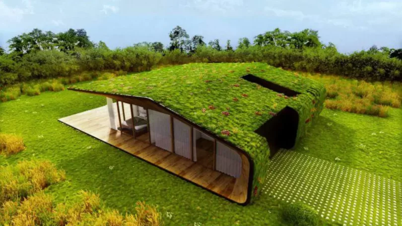 Une magnifique maison au toit végétalisé qui se confond parfaitement avec le paysage
